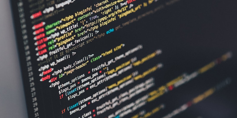 Engineer optimizing performance in code on screen